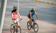 Ciclysts using protective face masks to prevent the spread of the novel Coronavirus pandem...
