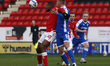 L-R Charlton Athletic's Chuks Aneke holds of Jack Tucker of Gillingham's during Sky Bet Le...