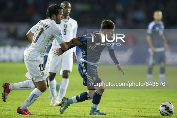 (150617) -- LA SERENA, June 17, 2015 () -- Lionel Messi (R) of Argentina vies with Alvaro Gonzalez of Uruguay during their Group B match at...