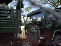 A Myanmar soldier stands guard during a demonstration against the military coup outside the Central Bank in Yangon, Myanmar on February 15,...