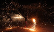 A Palestinian boy plays with fire crackers celebrating ahead of the Muslim holy month of R...