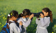 A Palestinian schoolgirl carries a secondary camera's of the photographer as she takes a p...