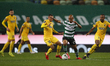 Joo Mrio avoids Ewerton and Dener during the game for Liga NOS between Sporting CP and Por...