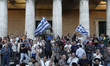 People demonstrate after entering the Greek Parliament area, in favor of Euro and European...