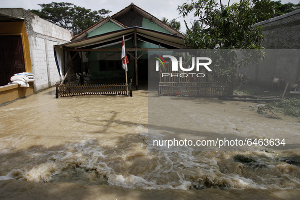 Floods hit a house in Pebayuran sub-district, Bekasi regency, West Java, on February 22, 2021. Massive floods hit a number of villages in Be...