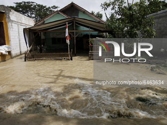 Floods hit a house in Pebayuran sub-district, Bekasi regency, West Java, on February 22, 2021. Massive floods hit a number of villages in Be...
