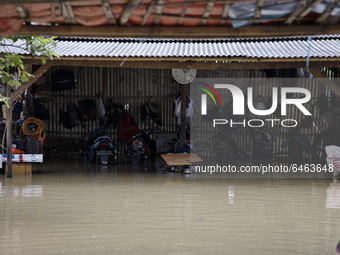Floods hit a motorbike service shop in Pebayuran sub-district, Bekasi regency, West Java, on February 22, 2021. Massive floods hit a number...