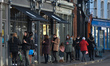 People lined up outside Thyme Out, a gourmet grocery store in Dalkey, a suburb of Dublin,...