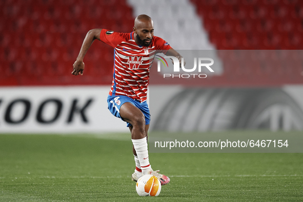 Dimitri Foulquier of Granada runs with the ball during the UEFA Europa League Round of 32 match between Granada CF and SSC Napoli at Estadio...