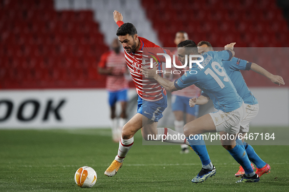 Jorge Molina of Granada and Nikola Maksimovic of Napoli compete for the ball during the UEFA Europa League Round of 32 match between Granada...