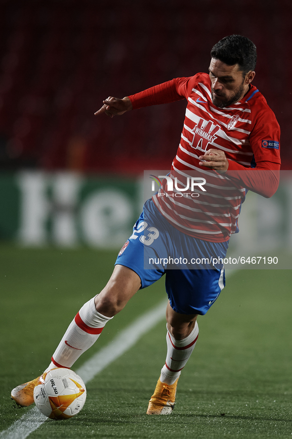Jorge Molina of Granada runs with the ball during the UEFA Europa League Round of 32 match between Granada CF and SSC Napoli at Estadio Nuev...