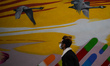 A man wearing a protective face mask walks by a mural in Dublin during Level 5 Covid-19 lo...