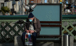 A man wearing a face mask resting on a bench in Dublin city center during Level 5 Covid-19...