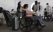 Older adults aged 60 years and over, in wheelchairs, inside the Tláhuac Forest in Mexico C...