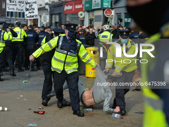 Members of Garda (Irish Police) clash with protesters during Anti-Lockdown protest on Grafton Street in Dublin city center during Level 5 Co...