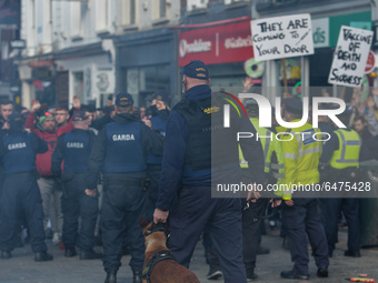 Members of Garda (Irish Police) clash with protesters during Anti-Lockdown protest on Grafton Street in Dublin city center during Level 5 Co...