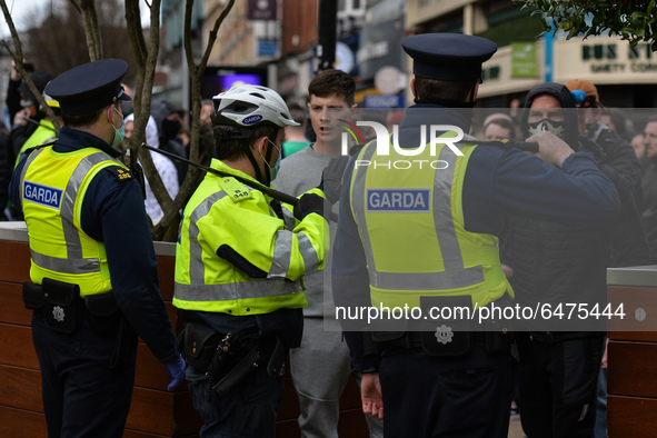 Members of Garda (Irish Police) block protesters in Grafton Street from passing further during Anti-Lockdown protest outside Saint Stephen's...