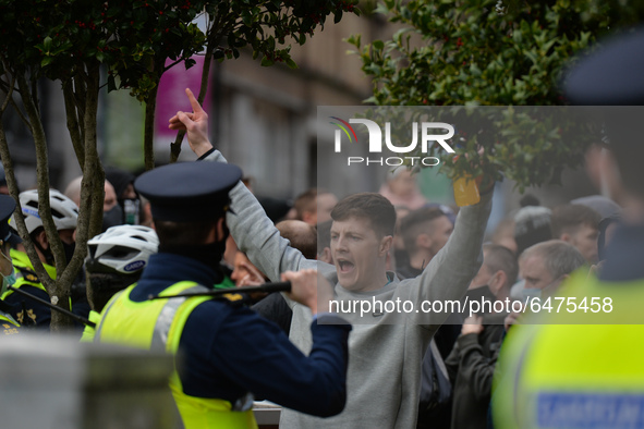 Members of Garda (Irish Police) clash with protesters during Anti-Lockdown protest outside Saint Stephen's Green entrance, during Level 5 Co...