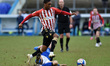 Oldham Athletic's Dylan Fage tussles with Joe Riley of Carlisle United during the Sky Bet...