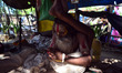 An indian sadhu performs yoga in his temporary tent  as world celebrates International Yog...
