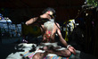 An indian sadhu performs yoga in his temporary tent  as world celebrates International Yog...