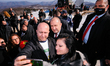 Followers take selfies with the President of Bulgaria Rumen Radev on the stairs to Shipka...