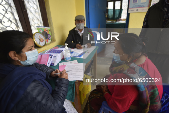 A Health worker counselling Nepalese People above 65 before getting first dose of COVID19 vaccines developed by Oxford- AstraZeneca Plc at B...
