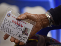 A Nepalese People above 65 shows social security card for verification before getting first dose of COVID19 vaccines developed by Oxford- As...
