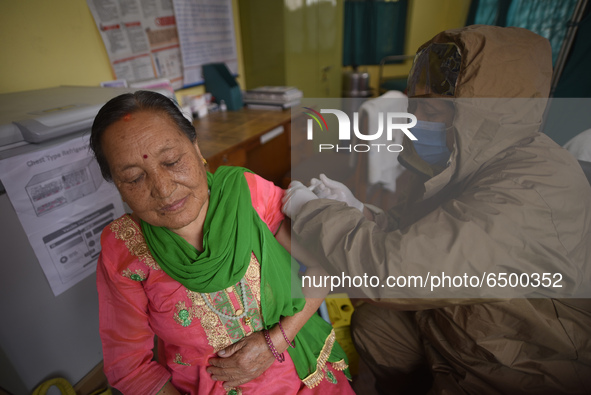 Nepalese People above 65 gets first dose of COVID19 vaccines developed by Oxford- AstraZeneca Plc at Bal Kumari Health Post, Kirtipur, Kathm...