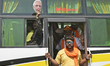 Activists shout slogans, carries a cut out of India's Prime Minister Narendra Modi, placar...