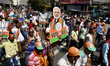 Activists shout slogans, carries a cut out of India's Prime Minister Narendra Modi, placar...