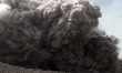 Sinabung volcano spews smoke pyroclastic flows into the sky, in the village of Guruh Kinay...