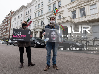 LONDON, UNITED KINGDOM - MARCH 08, 2021: Richard Ratcliffe (R) and Amnesty International activists protest outside the Embassy of Iran in Lo...