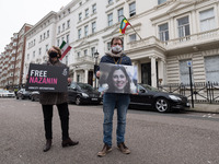 LONDON, UNITED KINGDOM - MARCH 08, 2021: Richard Ratcliffe (R) and Amnesty International activists protest outside the Embassy of Iran in Lo...