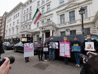 LONDON, UNITED KINGDOM - MARCH 08, 2021: Richard Ratcliffe (4L), his daughter Gabriella (6) (3L) and Amnesty International activists protest...