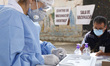A nurse prepares a dose of Pfizer-BioNTech Covid-19 vaccine before inject to an elderly, d...