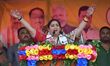 Union Minister Smriti Irani speaks during an election campaign rally ahead of the Assam as...