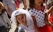 Girls dressed in wedding dress attend during the celebrations of the Orthodox feast Eniovd...