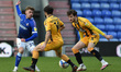  Oldham Athletic's Alfie McCalmont tussles with Wesley Hoolahan of Cambridge United and Ja...