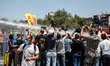 ISTANBUL, TURKEY--Journalists film the police firing water cannons at protesters in Taksim...