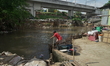 Activities of residents around the banks of the Ciliwung River in the Manggarai area, Jaka...