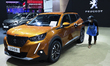 A staff cleans a car Peugeot 2008 during at the 42nd Bangkok International Motor Show 2021...