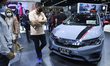 People look at Honda City HATCHBACK cars during at the 42nd Bangkok International Motor Sh...