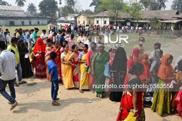 oters wait in queue to cast their ballots at a polling station during Phase 1 of Assam's legislative election in Nagaon district, in the nor... by Anuwar Hazarika/NurPhoto