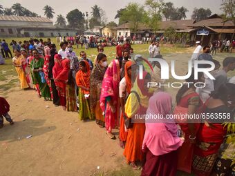 oters wait in queue to cast their ballots at a polling station during Phase 1 of Assam's legislative election in Nagaon district, in the nor... by Anuwar Hazarika/NurPhoto