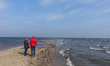 People looking at the end of the Rewa Peninsula are seen in Rewa, Poland on 27 March 2021...