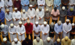 Indian muslims perform friday prayers in a mosque during the religious month of Ramadan,in...