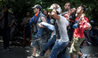 ISTANBUL, TURKEY--Protesters carry an injured man to a makeshift clinic in Gezi Park durin...