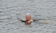 LONDON, UNITED KINGDOM - MARCH 29, 2021: A woman enjoys a morning swim in the Serpentine L...