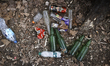 Plastic and glass bottles are seen disposed off in a forest in Warsaw, Poland on March 28,...